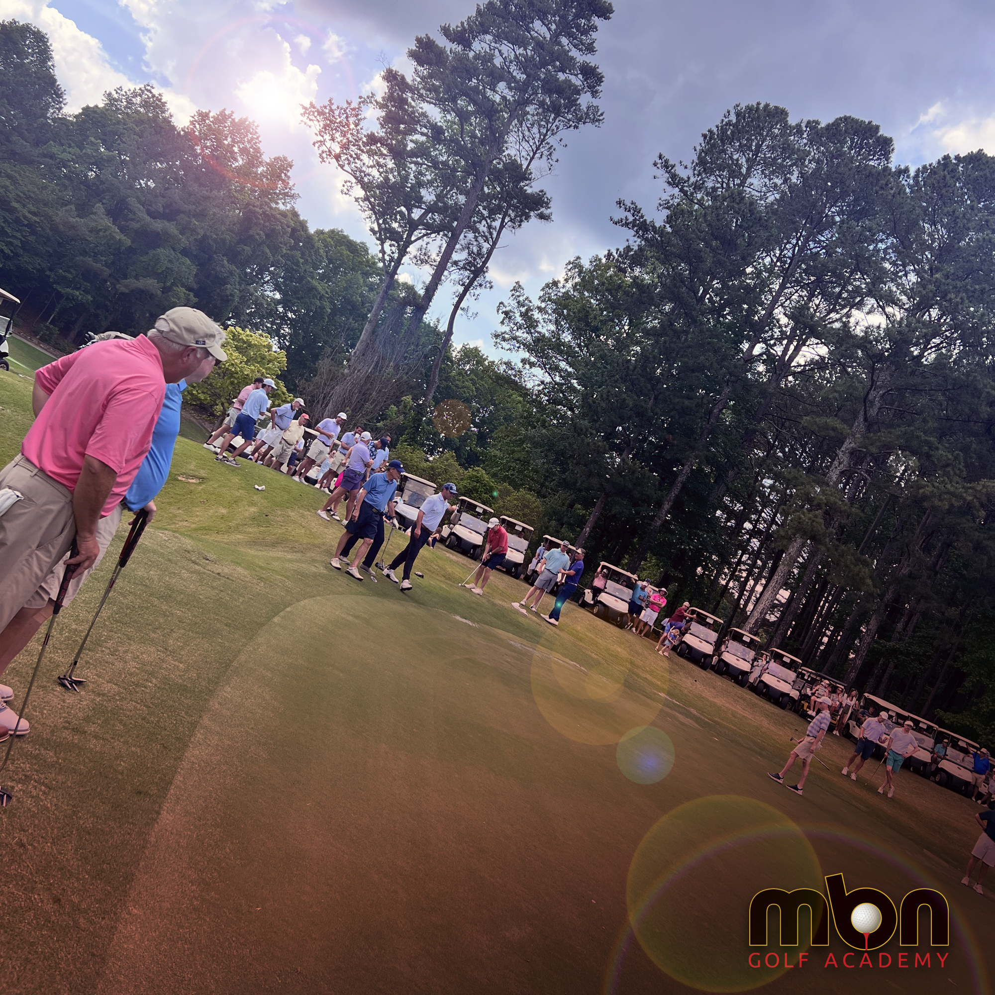 MBN tournament — full gallery with players and carts on the fairway